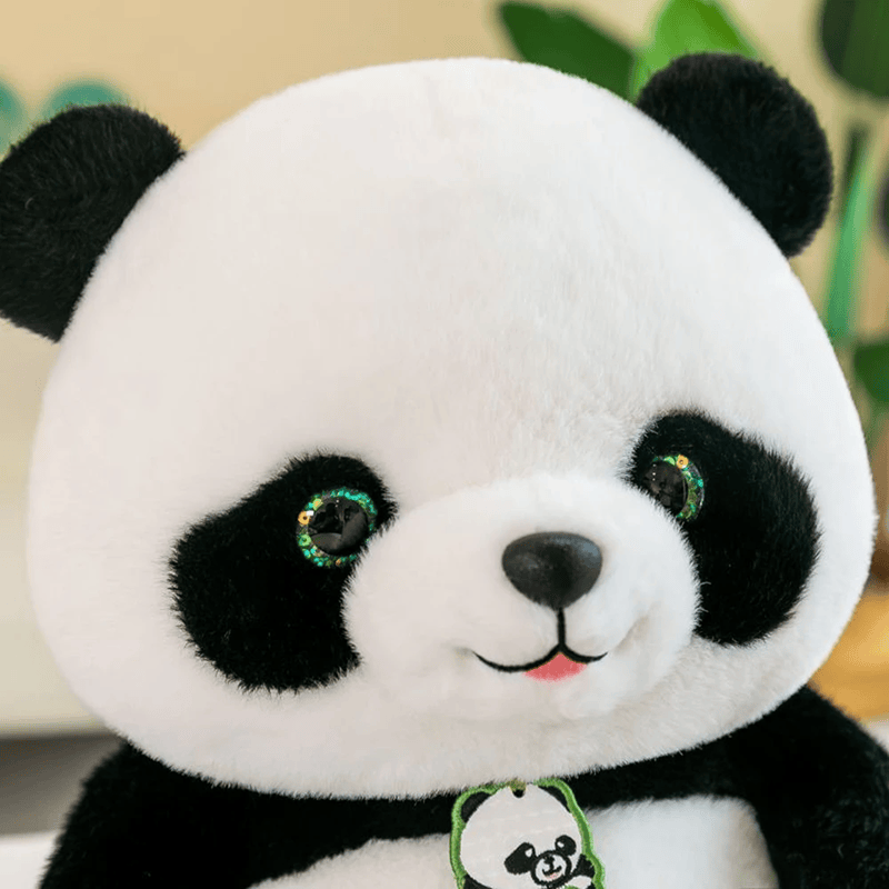 La peluche panda mignonne zoom sur sa tête