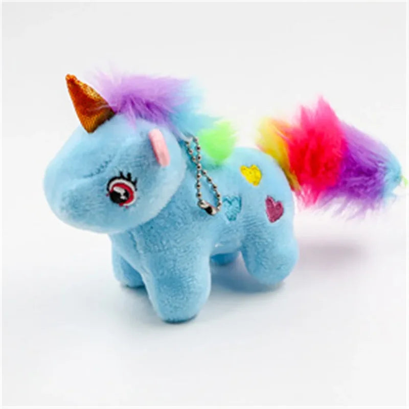 Mini peluche licorne bleue sur fond blanc