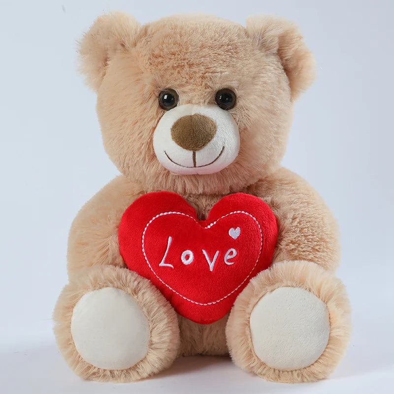 Ours beige en peluche avec un coeur