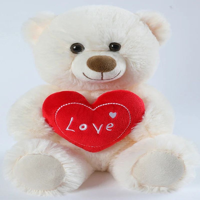 Ours blanc en peluche avec un coeur
