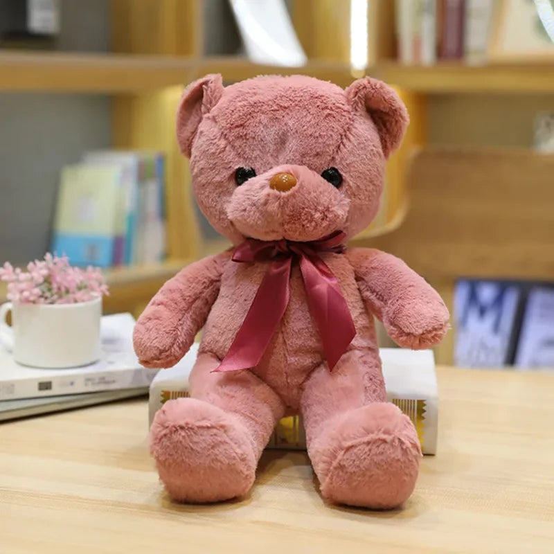 Ours rose sombre en peluche couleur émotion sur une table