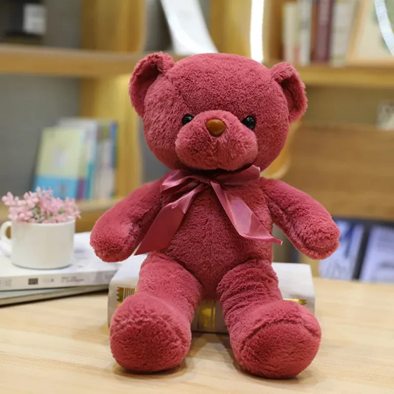 Ours rose en peluche couleur émotion sur une table