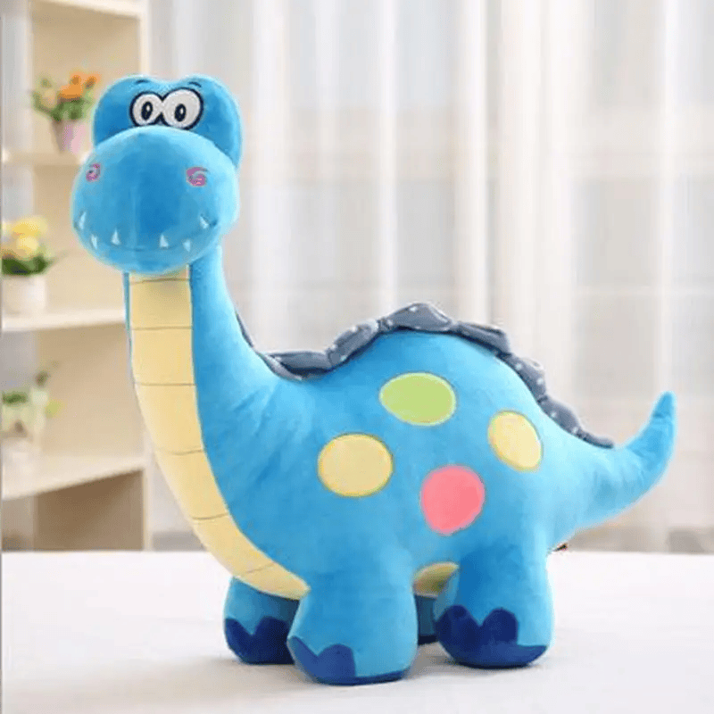 Peluche brontosaure bleu sur un meuble blanc Image