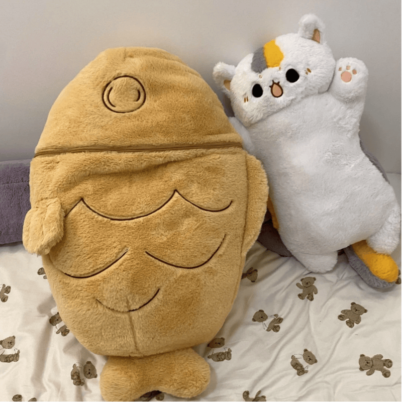 Peluche chat en Taiyaki sur un lit  Image