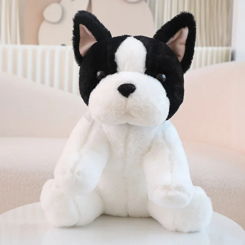 Peluche chien blanc Bouledogue Français sur un canapé