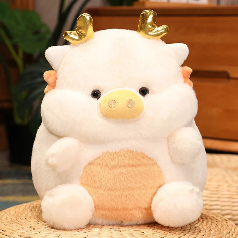 Peluche cochon dragon blanc sur un panier en osier Image