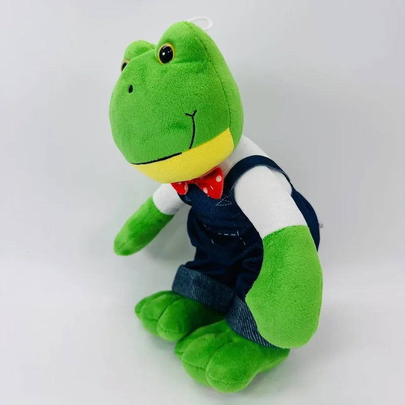 Peluche grenouille en salopette de profil
