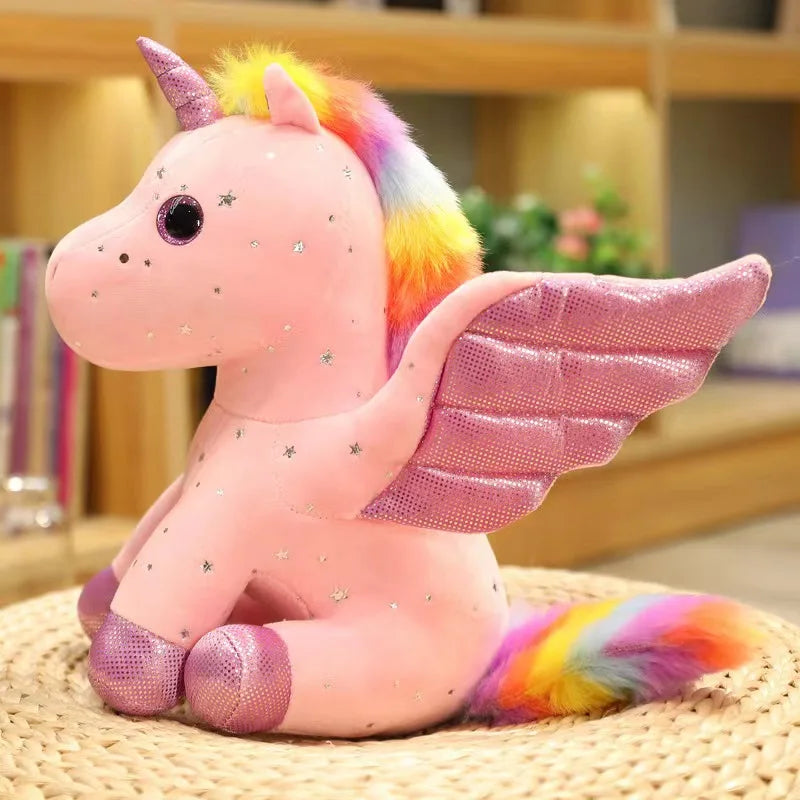 Peluche licorne rose ange sur un panier en osier