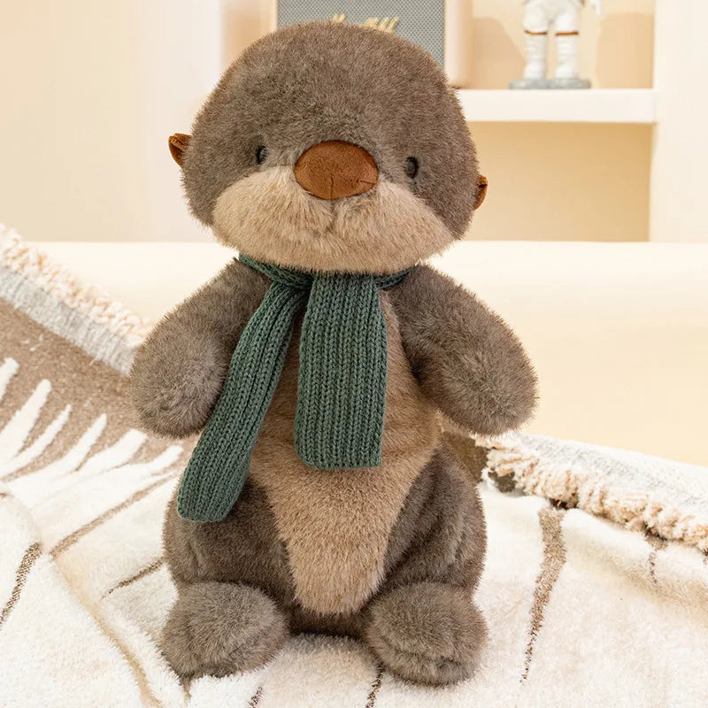 Peluche loutre avec écharpe