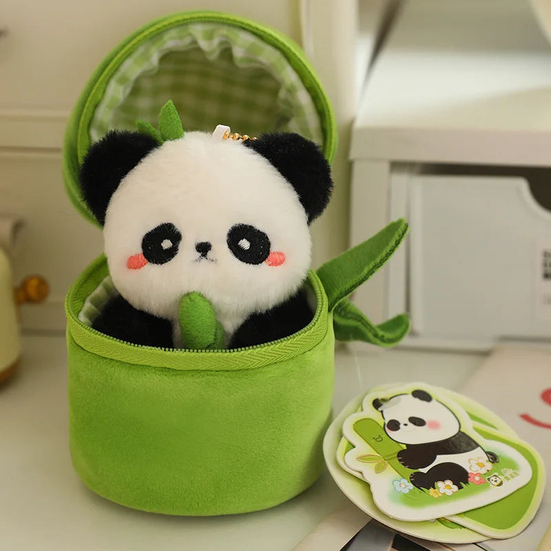 Peluche panda dans son bambou sur une table Image