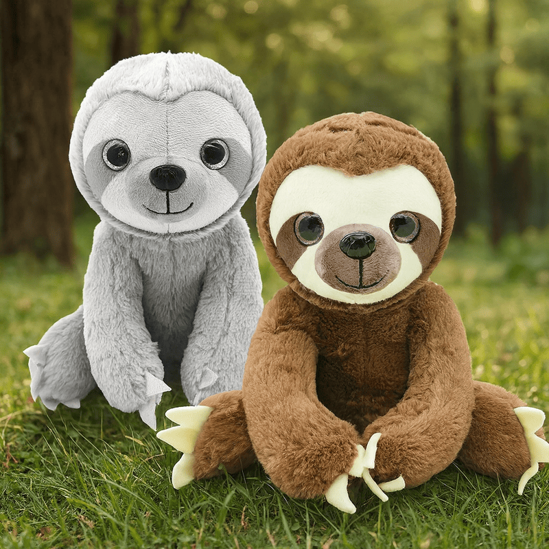 Deux peluches paresseux sur gazon Image