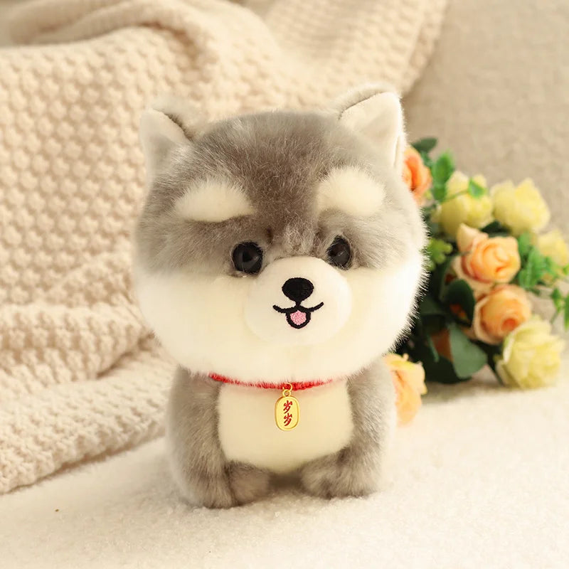 Peluche petit chien husky sur un tapis 
