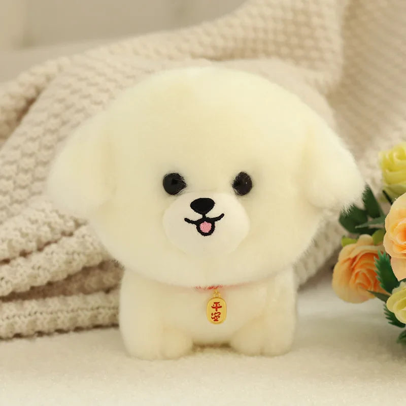 Peluche petit chien bichon frise sur un tapis 