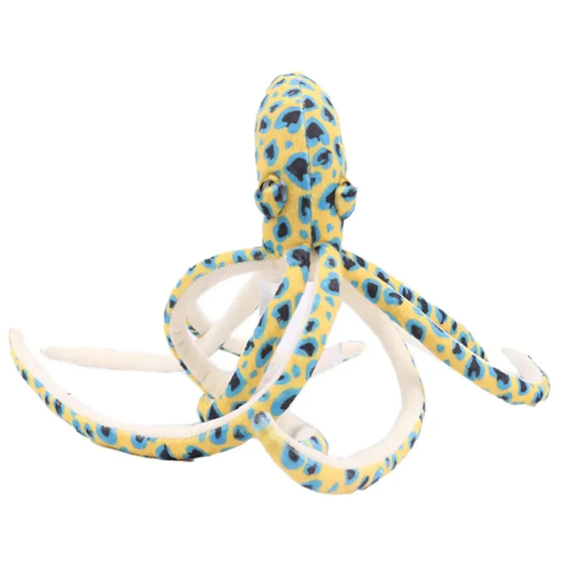Peluche pieuvre à pois jaune sur un fond blanc