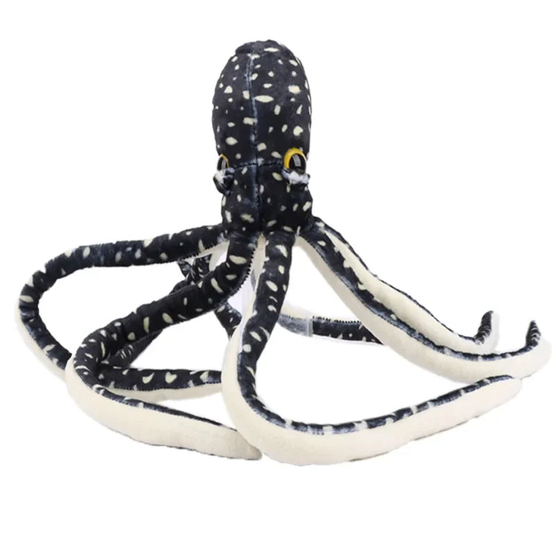 Peluche pieuvre à pois bleu sur un fond blanc