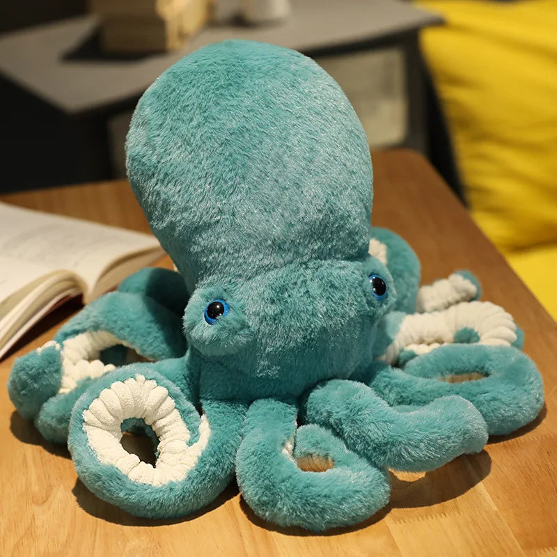 Peluche pieuvre douce verte sur une table