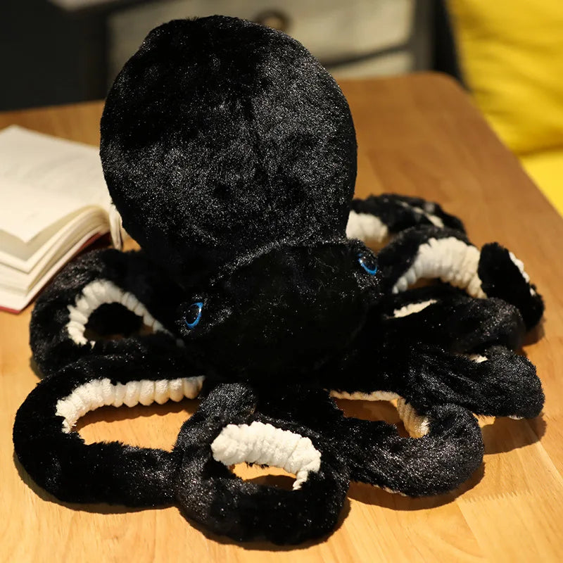 Peluche pieuvre douce noir sur une table