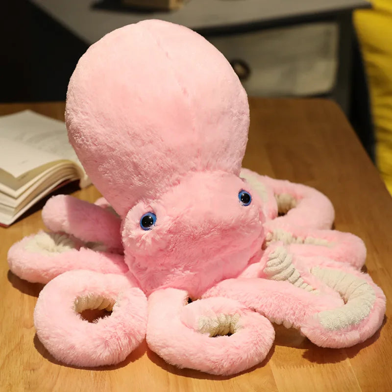 Peluche pieuvre douce rose sur une table