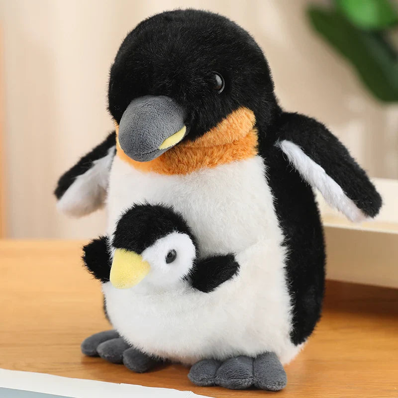 Peluche pingouin maman & fils sur une meuble