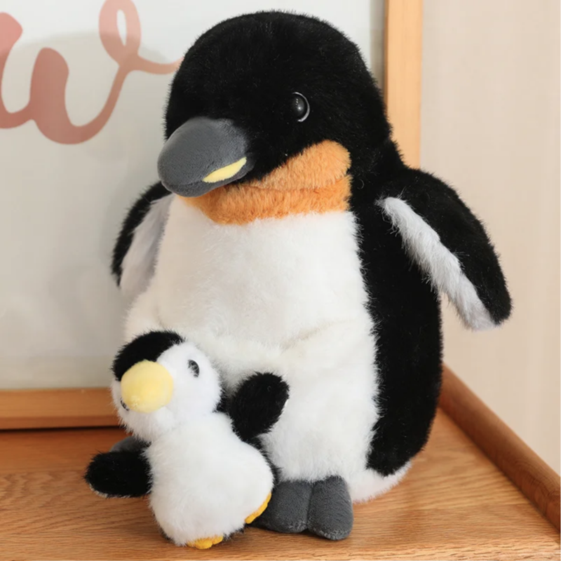 Peluche pingouin maman & fils sur un meuble Image