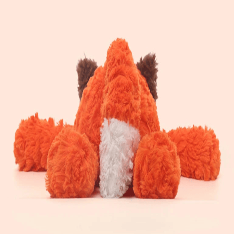 Peluche renard japonaise de dos sur fond beige