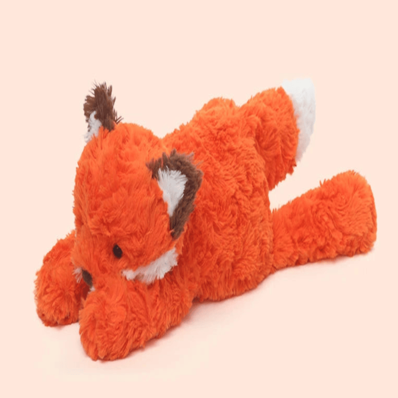 Peluche renard japonaise de profil sur fond beige Image