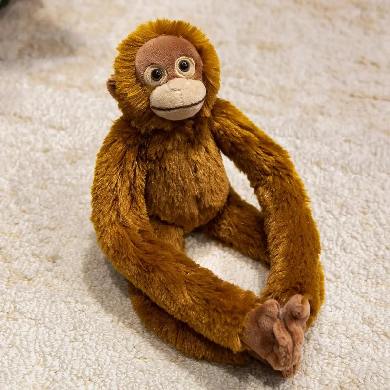 Peluche orang-outan sur un tapis Image