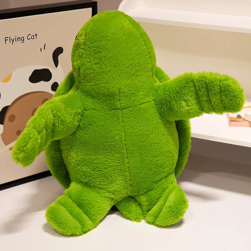 Peluche tortue colorée verte debout sur un meuble blanc