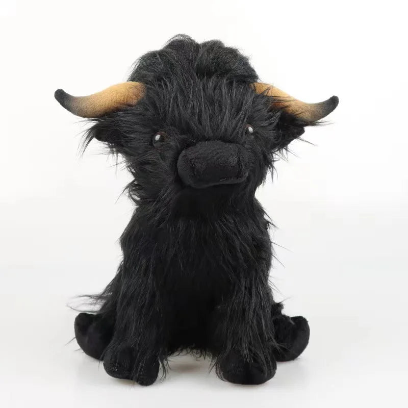 Peluche vache highland noir sur fond blanc