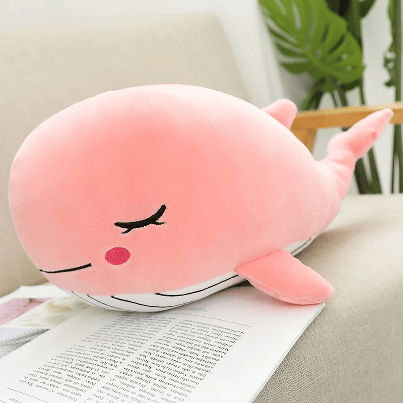 Peluche baleine rose sur un fauteuil Image