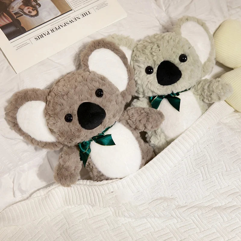Deux peluches koalas sous la couette Image